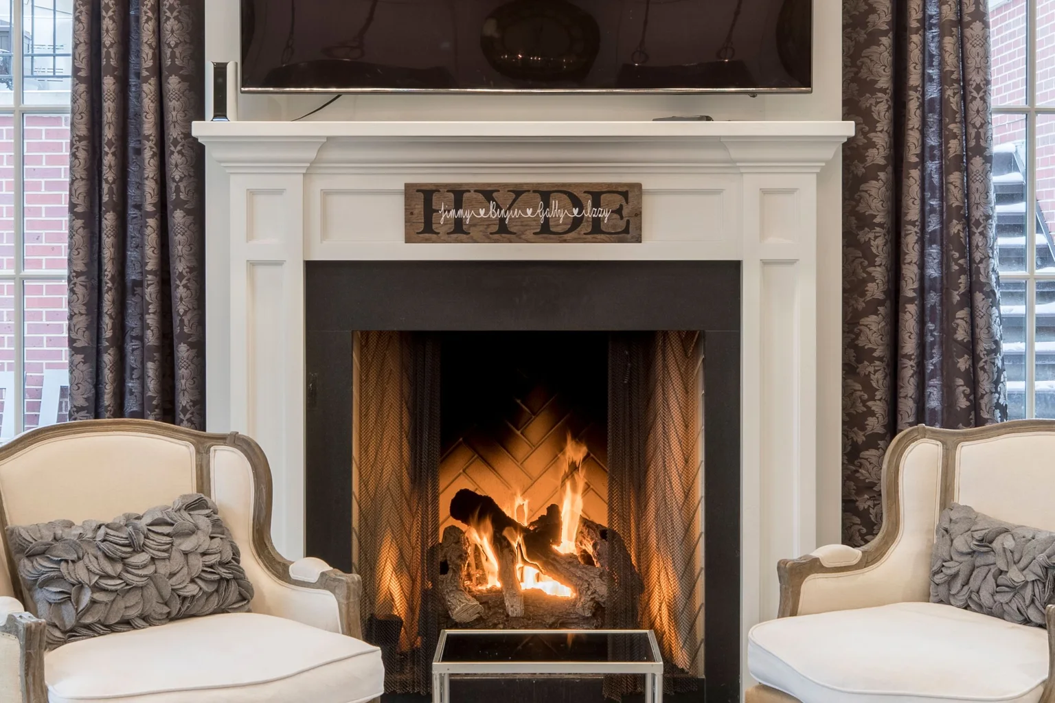The same fireplace with a warm fire lit, after HomeHDR